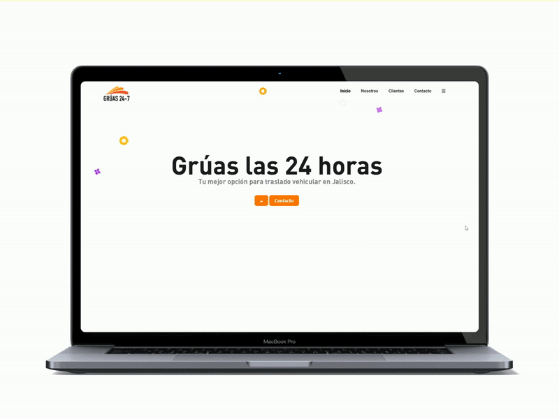 A laptop with the gruas 24-7 web-page on the screen.